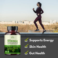 Healthy lifestyle scene with moringa capsules and fresh greens