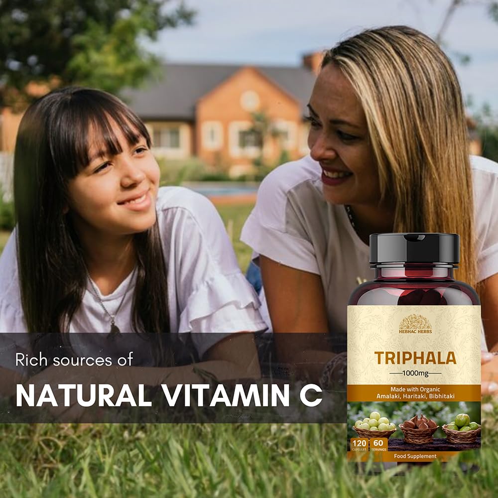 Triphala capsules on white background