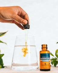 Herb Pharm passionflower liquid in a glass demonstrates ready-to-use dosing.