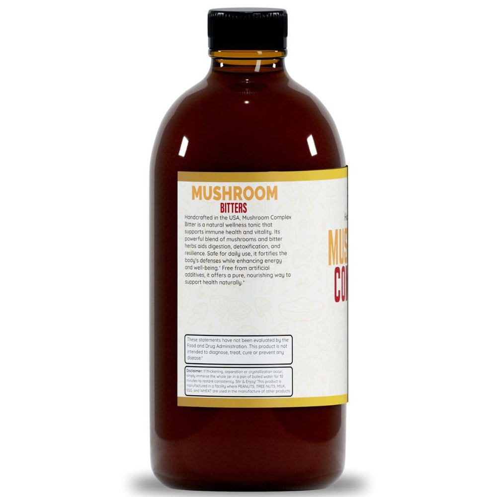 Herb To Body Mushroom Bitters label close-up emphasizing alcohol-free formula.