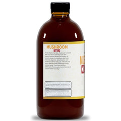 Herb To Body Mushroom Bitters label close-up emphasizing alcohol-free formula.