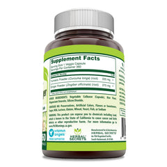 Close-up of turmeric and ginger capsules in a veggie capsule bottle