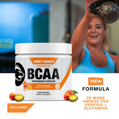 Scoop of Honey Badger BCAA + EAA powder being added to water