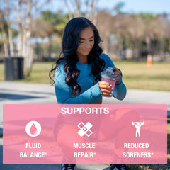 Pouring Honey Badger BCAA + EAA powder into a glass for hydration