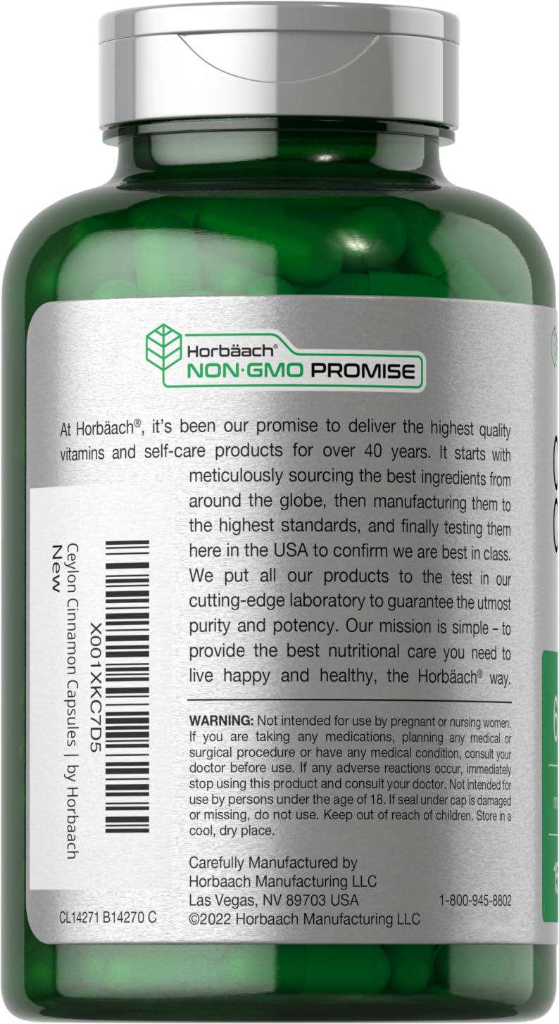 Ceylon Cinnamon capsules poured from bottle into a spoon