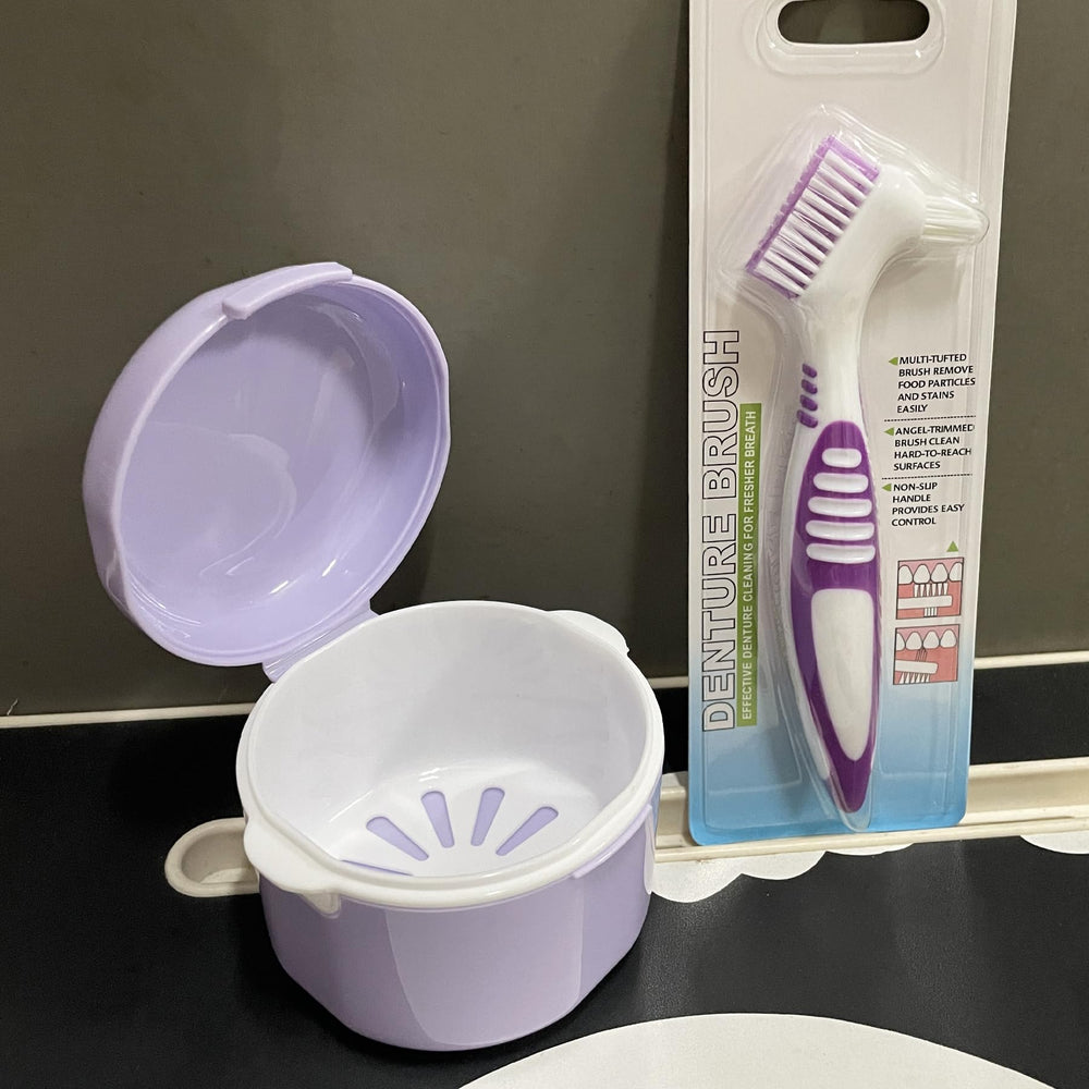 Two-headed denture cleaning brush with rubber grip