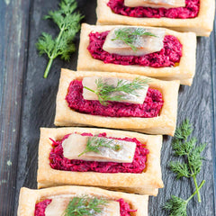 HQOExpress organic beetroot powder pouring into a glass for nutrient-rich drinks.