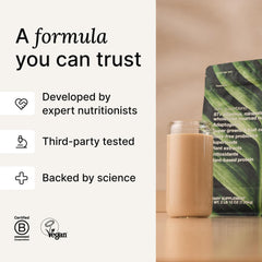 Huel Daily Superblend Vanilla in a glass with ice and milk