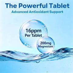 Close-up of a single hydrogen tablet dissolving in a glass of water