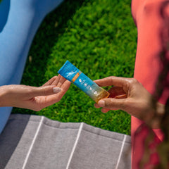 HydroMATE electrolytes orange packaging box set against travel image for convenience