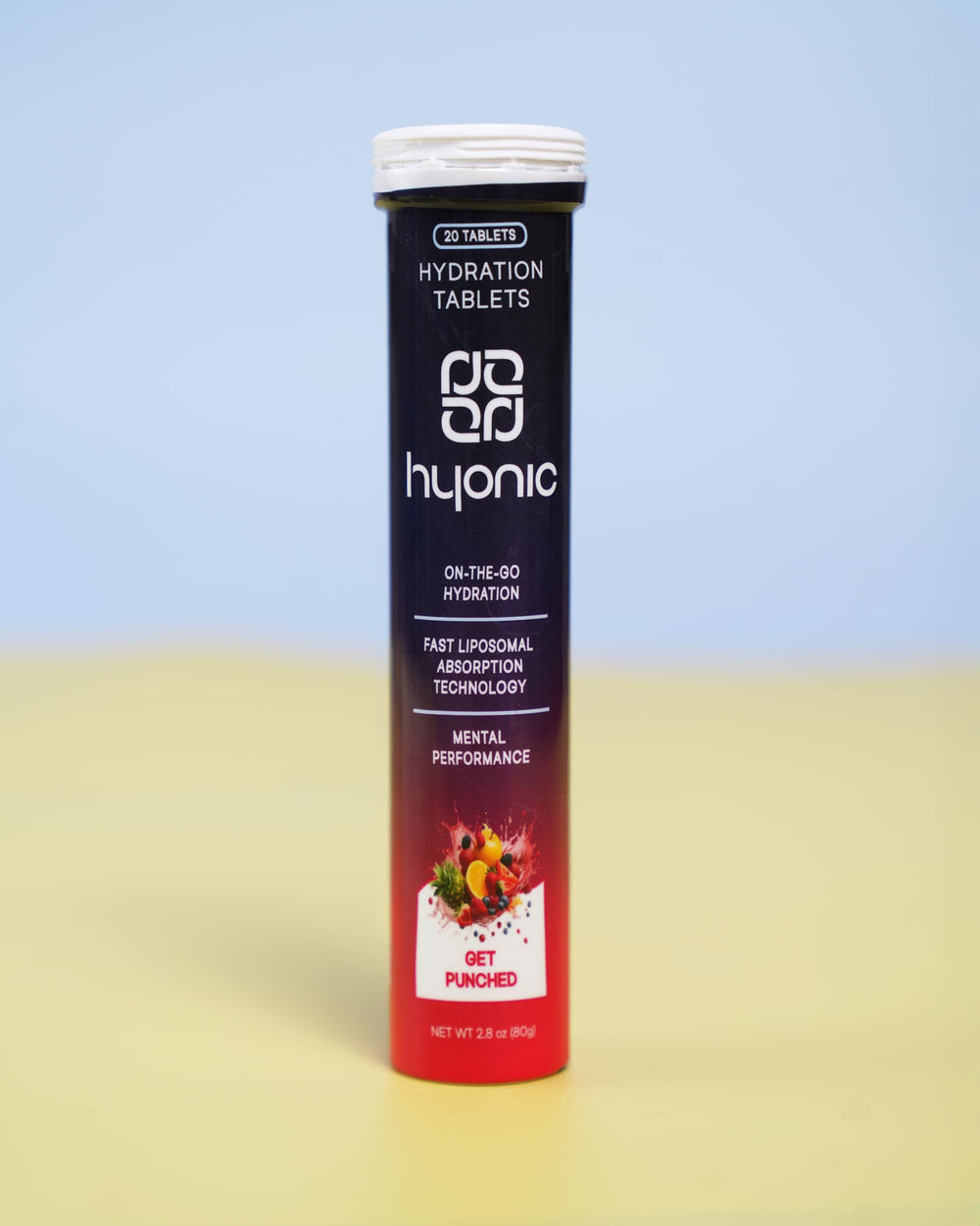 Pouring a Hyonic tablet into a glass of water