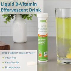 Orange-flavored B-complex effervescent tablet dissolving in water