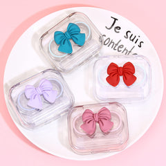 Close-up of tweezers included with iGeyzoe Bowknot lens case set