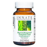 Front view of the Innate Thyroid Response Complete Care bottle with Ashwagandha capsules.