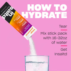 A glass of water with INSALTD Mango Passionfruit dissolved