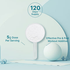 Scoop of creatine powder beside the canister