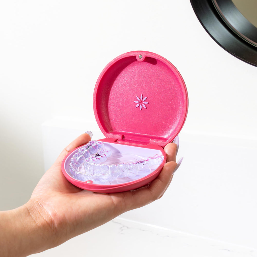 Official Invisalign case branding in magenta
