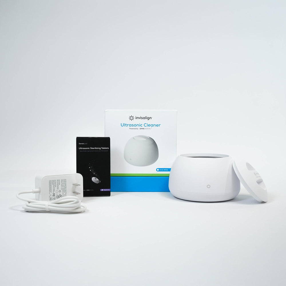 Invisalign Ultrasonic Cleaner shown beside an aligner case