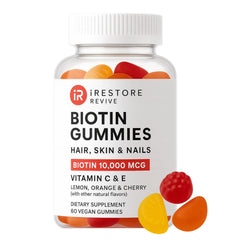 iRestore Hair Gummy Vitamins bottle with Biotin 10000mcg label.