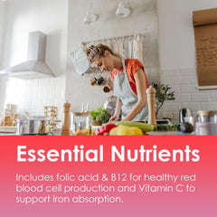 Lifestyle image of a woman taking iron gummies