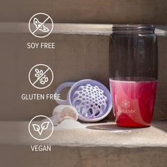 Isagenix Amped Nitro bottle placed with workout gear emphasizing portability and energy support.