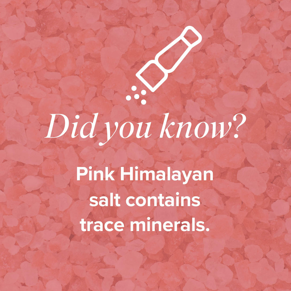 Glass of water with Isagenix Hydrate dissolving in water