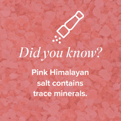 Glass of water with Isagenix Hydrate dissolving in water