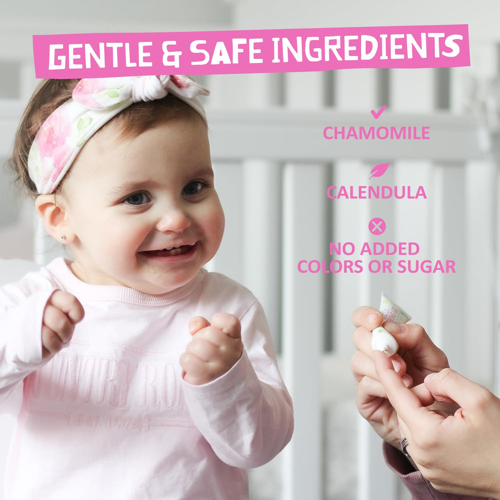 Close-up of teething baby gums with gel