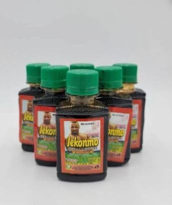 Jekonmo Herbal Mixture packaging and bottle on a wooden surface