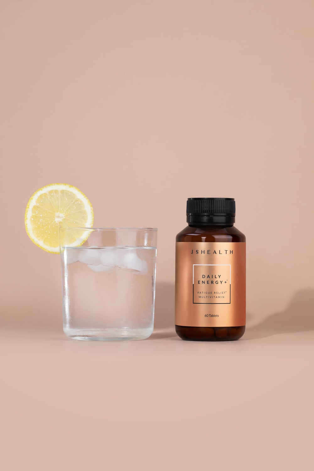 JSHealth Daily Energy Supplement pills closeup highlighting energy and focus benefits.