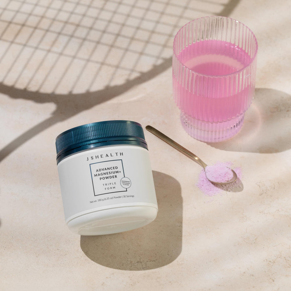 Close-up of powder scoop with Raspberry Lemonade flavor