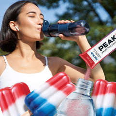 Juicy Mixes PeakH2O being stirred into water for quick hydration on the go.