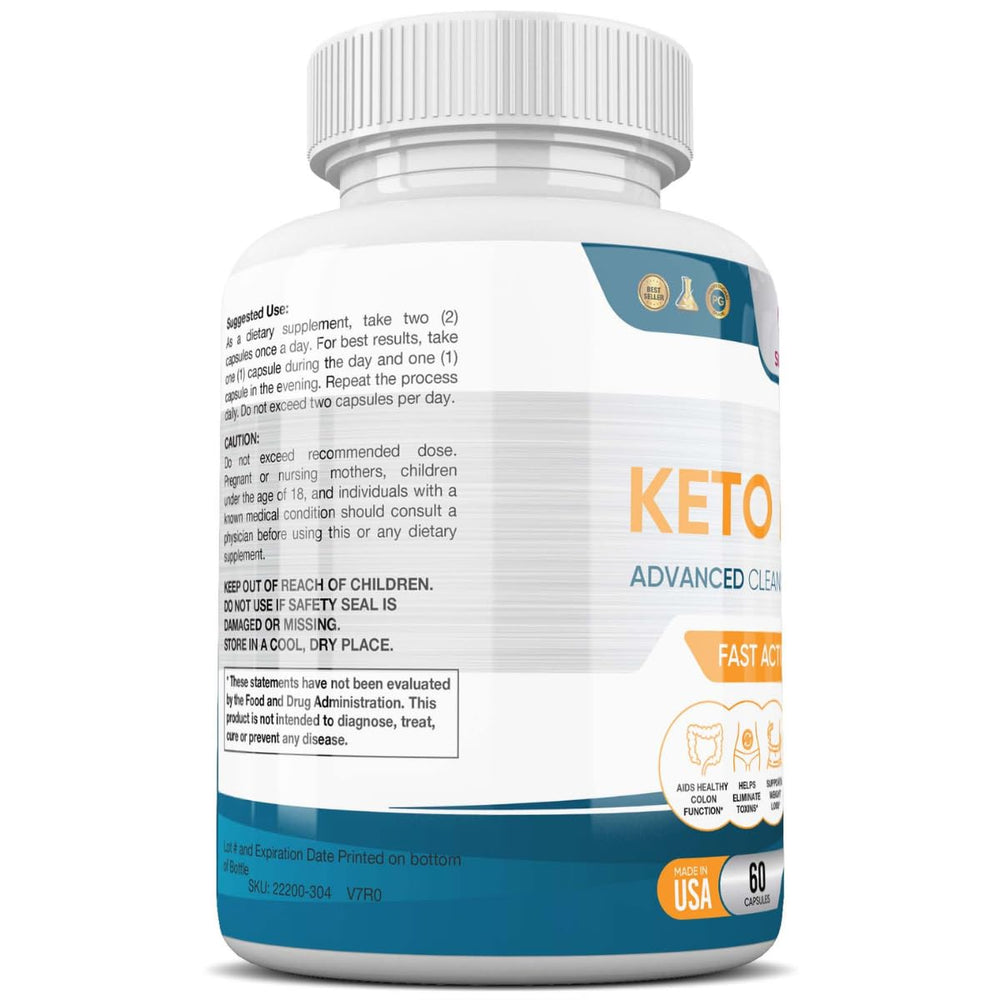 Keto Detox+ capsules beside measuring cup on white