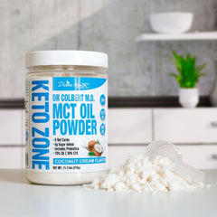 Scooping Keto Zone MCT Oil Powder for a beverage
