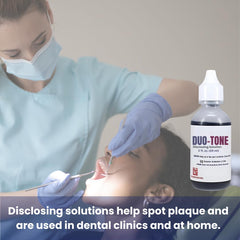 Person rinsing mouth after applying the disclosing solution