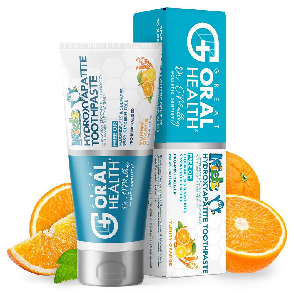 Orange-flavored kids toothpaste bottle on white