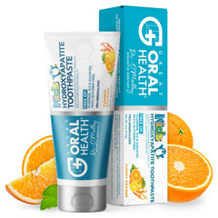Orange-flavored kids toothpaste bottle on white