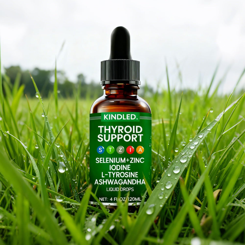 Glass of water with Kindled Thyroid Support Drops being prepared