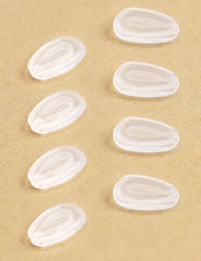 Close-up of Kygear silicone nose pads installation on sunglasses