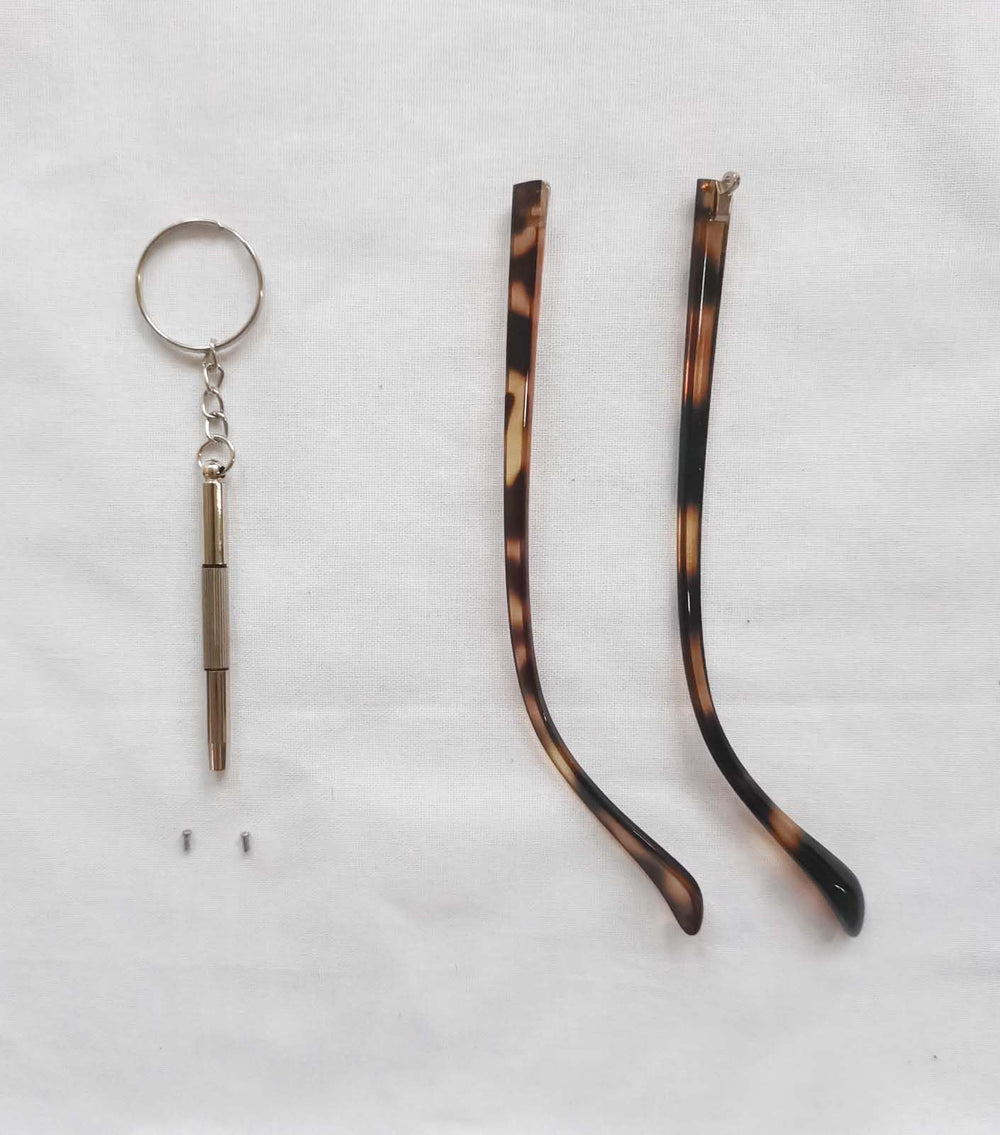 Package contents: replacement temple arms, screws, washers, screwdriver