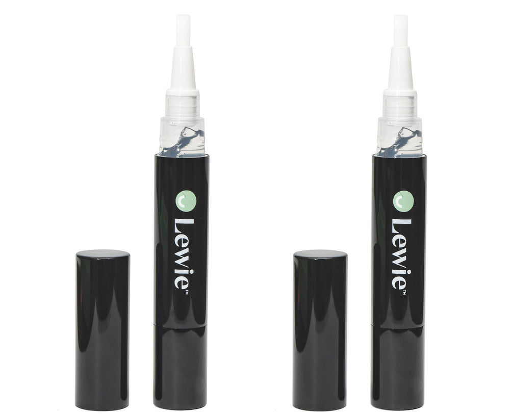 Whitening pen being applied to teeth