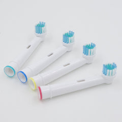 Soft bristle brush heads with color-coded rings for easy identification