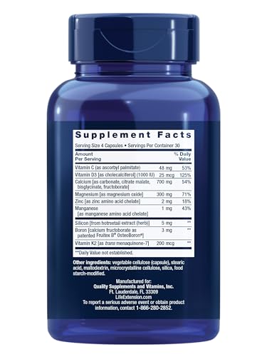 Bone Restore capsules spilling from bottle Bone Restore capsules spilling from bottle