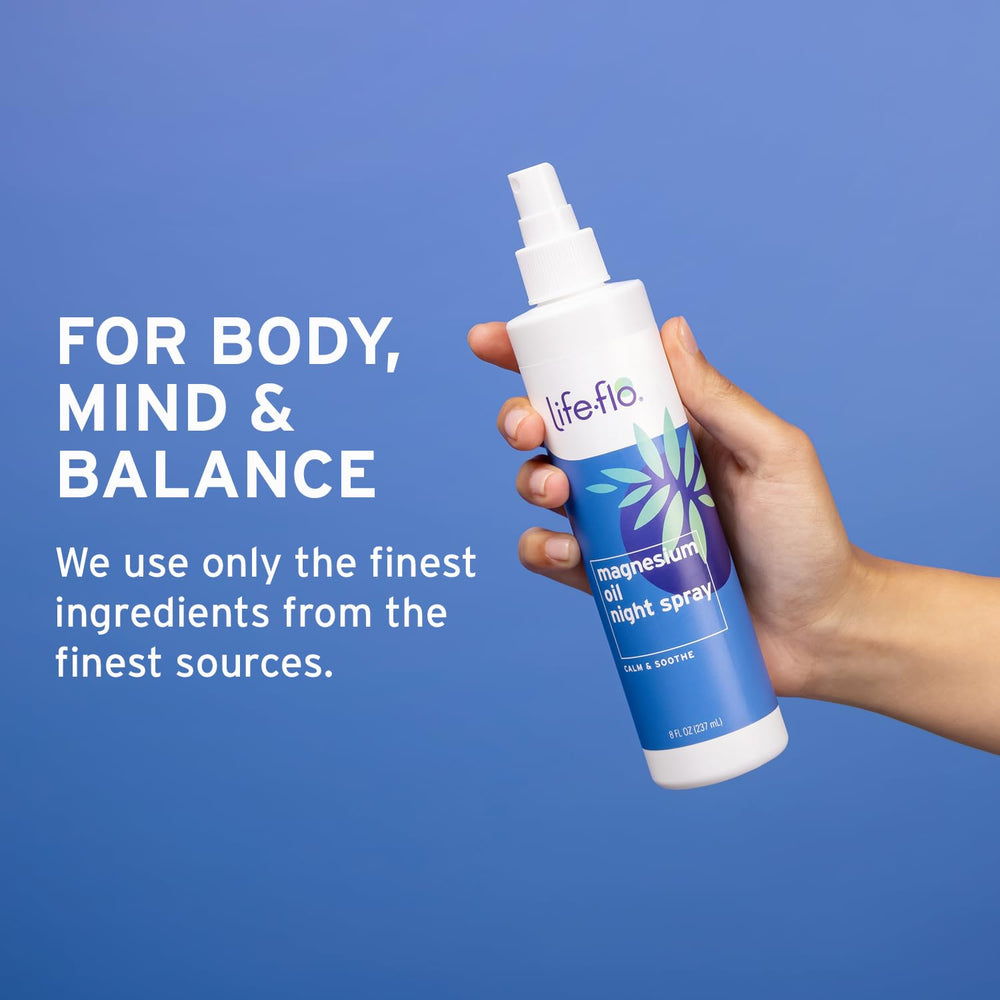 Person applying magnesium oil night spray to skin before bed