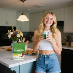 Lifebooil in a lifestyle shot with apple and person sipping highlighting enjoyable taste