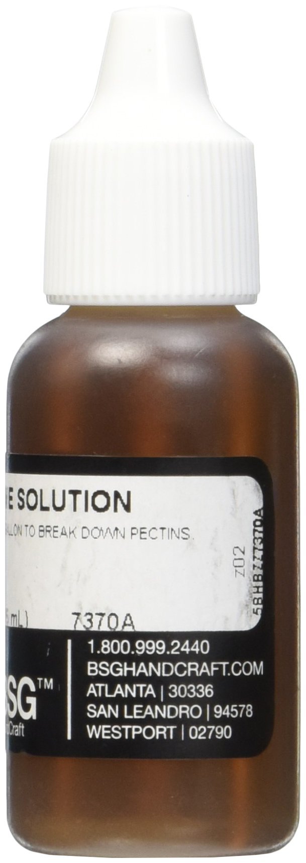 Wine making with liquid pectic enzyme bottle and glass of clear wine