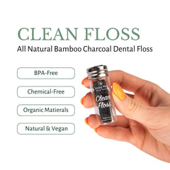 Floss spool and toothbrush bristles in focus