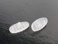 Nose pads installed on glasses showing non-slip ridged design