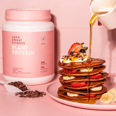 Love Sweat Fitness protein chocolate label close-up emphasizes organic pea and brown rice blend.