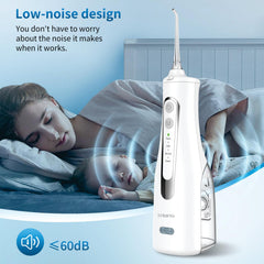 Person using the water flosser for gum massage and cleaning